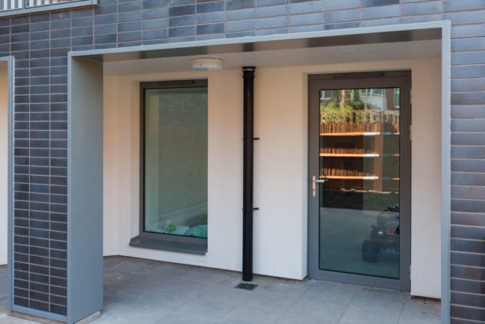 Modern grey aluminium front door for contemporary homes